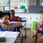 african-american-female-teacher-and-a-girl-talking-2023-11-27-05-04-29-utc